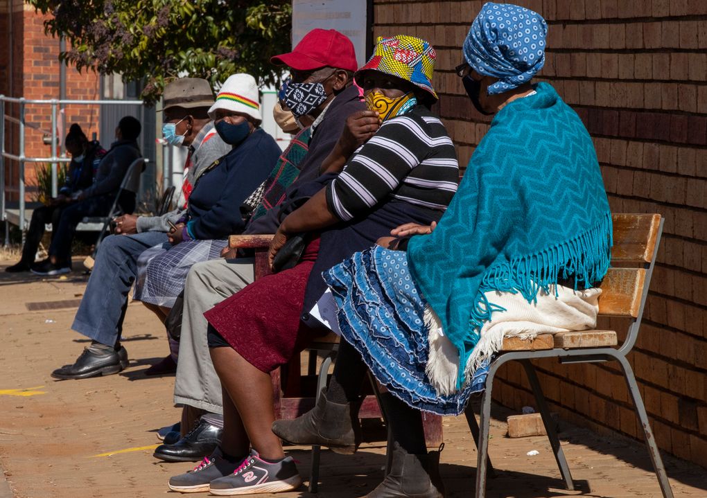 Retirees wait to receive a first dose of the Pfizer coronavirus vaccine in a tent during a mass vaccination program for the elderly at a clinic outside Johannesburg, South Africa, Monday, May 24, 2021. South Africa aims to vaccinate 5 million of its older citizens by the end of June. (AP Photo/Themba Hadebe)