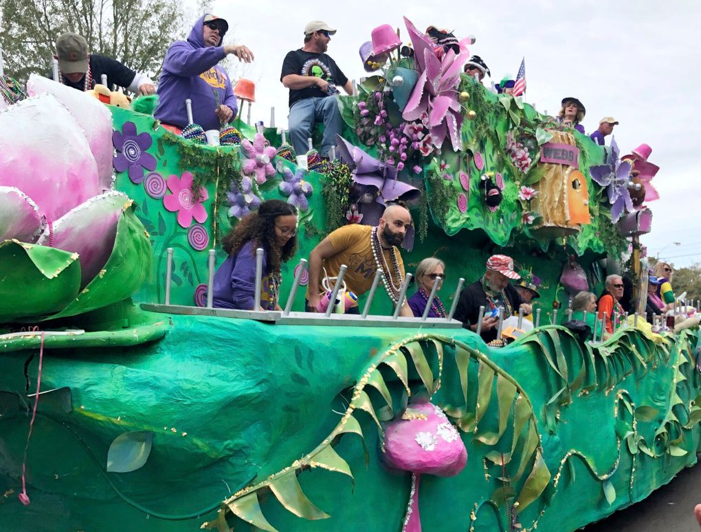 FILE – In this Feb. 23, 2020 file photo, float riders toss beads and other items to crowds during a Mardi Gras parade in Mobile, Ala. Mobile is putting on a Mardi Gras-style parade that will feel at least a little like the Carnival celebrations that were canceled earlier this year because of the pandemic. Plastic beads and other trinkets will fly as almost 30 floats from Mardi Gras groups snake through downtown Mobile on Friday, May 21, 2021. (AP Photo/Paul Newberry)