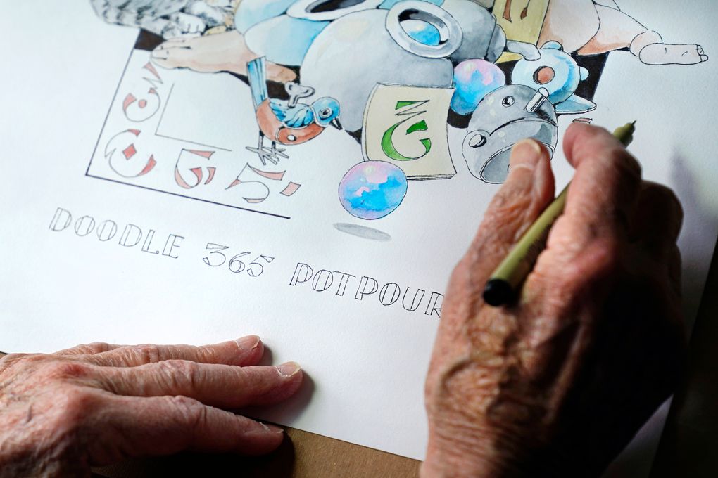 Artist Robert Seaman works on his 365th daily doodle in his room at an assisted living facility Monday, May 10, 2021, in Westmoreland, N.H. Seaman, who moved into the facility weeks before the COVID-19 pandemic shutdown his outside world in 2020, recently completed his 365th daily sketch, or what he calls his “Covid Doodles”, since being isolated due to the virus outbreak. (AP Photo/Charles Krupa)