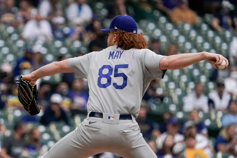 Dodgers' May leaves game with elbow pain