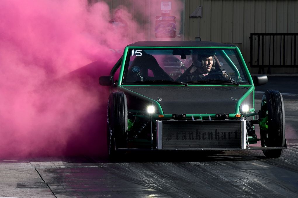 A racer spews pink smoke from his car during a “gender reveal” at Bandimere Speedway west of Denver on Wednesday, May 5, 2021. The Colorado State Patrol runs a program called “Take it to the Track” in hopes of luring racers away from public areas to a safer and more controlled environment, even allowing participants to race a trooper driving a patrol car. The program’s goals have gained new importance and urgency this year as illegal street racing has increased amid the coronavirus pandemic. (AP Photo/Thomas Peipert)