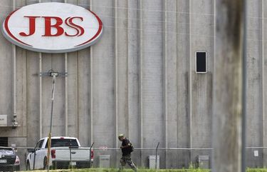 A person walks outside the JBS Beef Production Facility in Greeley, Colorado, U.S., on Tuesday, June 1, 2021. A cyberattack on JBS SA, the world’s largest meat producer, has forced the shutdown of some of the largest slaughterhouses globally, and there are signs that the closures are spreading. 775661913