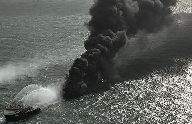 In this photo provided by Sri Lanka Air Force, smoke rises from the container vessel MV X-Press Pearl engulfed in flames off Colombo port, Sri Lanka, Wednesday, May 26, 2021. A fire on a container ship carrying chemicals raged off Sri Lanka for a sixth day Wednesday and India sent vessels to help douse the blaze, officials said. (Sri Lanka Air Force via AP) COL101 COL101