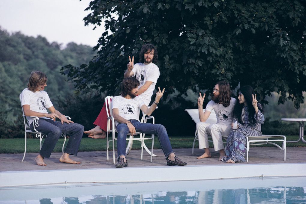 Left to right: Drummer Alan White, Eric Clapton (seated), bassist Klaus Voormann, John Lennon and Yoko Ono the day after the Plastic Ono Band headlined the Toronto Rock and Roll Revival show at Varsity Stadium, Toronto, September 1969. (Mark and Colleen Hayward / Getty Images)