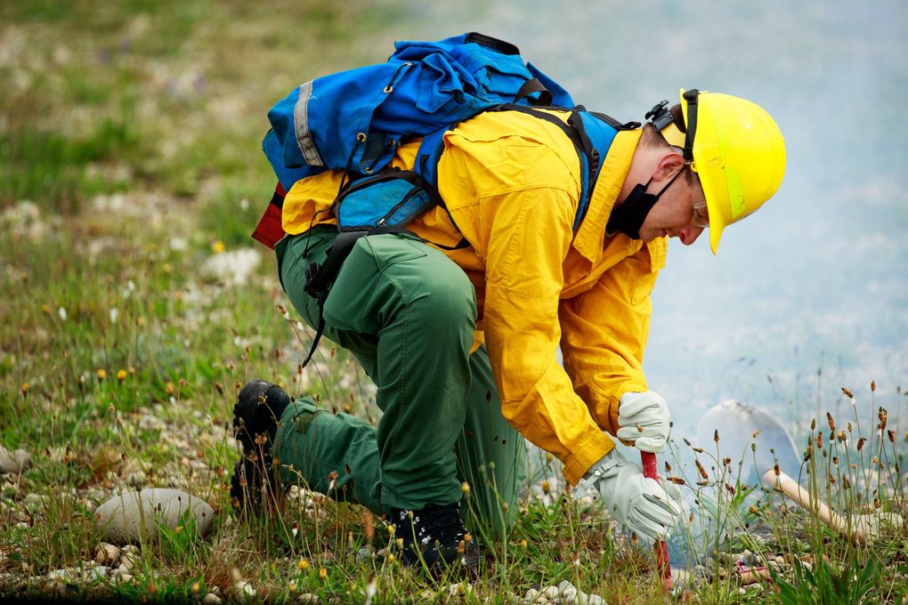 National Guardsmen attend a DNR wildfire training session on firing devices, including extinguishing fusees, seen above, at Joint Base Lewis-McChord last month. (Erika Schultz / The Seattle Times)