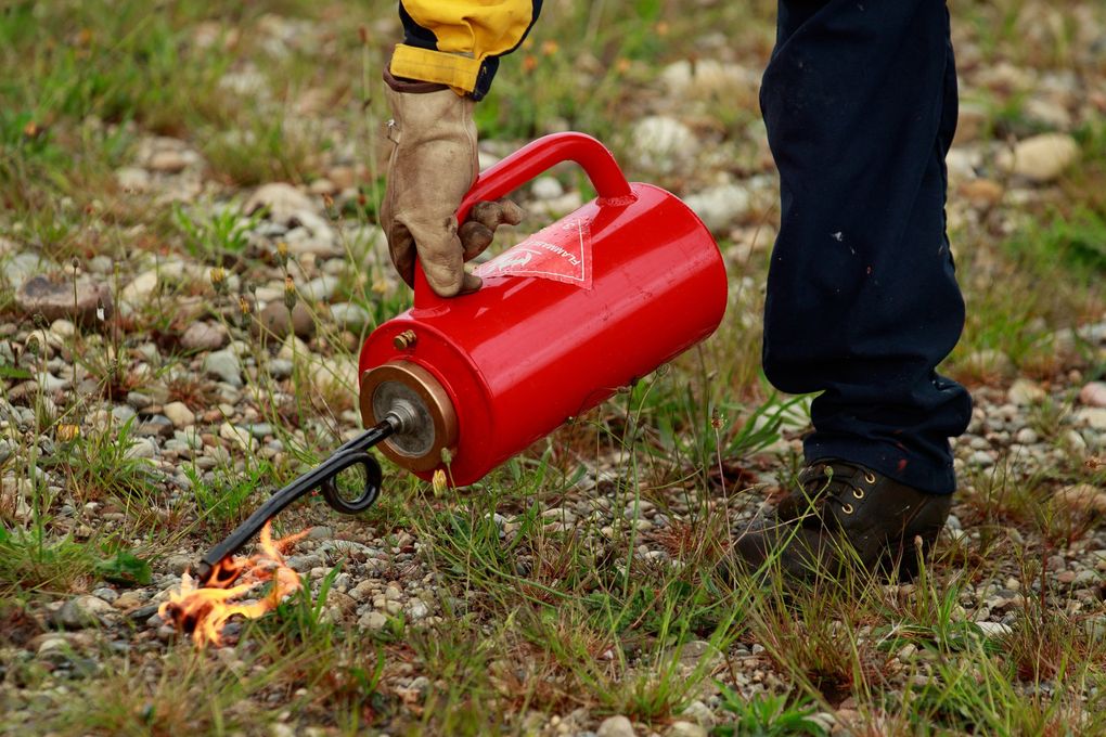 Jordan Simmonds, a captain with Eastside Fire and Rescue, leads a firing devices workshop during a state Department of Natural Resources wildfire training at Joint Base Lewis-McChord last month. (Erika Schultz / The Seattle Times)
