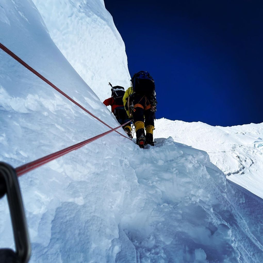Mark Pattison climbs a snow bank on Mount Everest. (Courtesy of Mark Pattison)