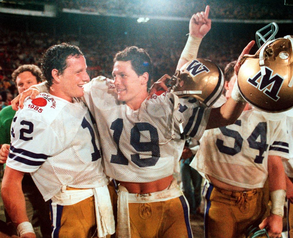 University of Washington Huskies Mark Pattison and Hugh Millen hug as the final seconds run off the clock in the 1985 Orange Bowl. (Harley Soltes / The Seattle Times)
