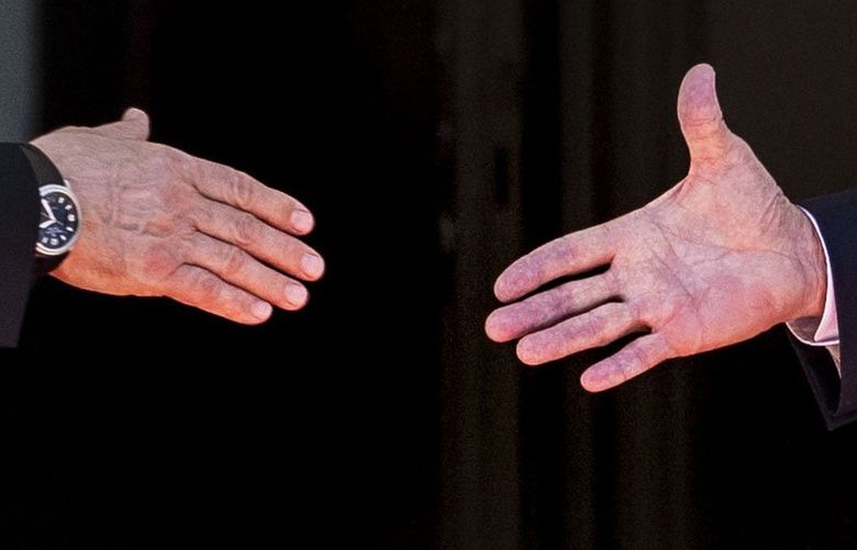 President Joe Biden’s hand, right, just before shaking hands with President Vladimir Putin of Russia outside the Villa La Grange, in Geneva, Switzerland, just before heading in to their meetings, Wednesday, June 16, 2021. (Doug Mills/The New York Times) NYT8