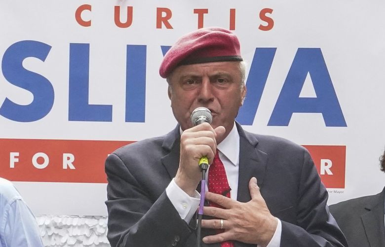 Republican mayoral candidate Curtis Sliwa, center is joined by former New York Mayor Rudy Giuliani, left, and businessman John Catsimatidis at a campaign event, Monday, June 21, 2021, in New York. Giuliani and Catsimatidis endorsed Sliwa. (AP Photo/Mary Altaffer) NYMA104 NYMA104