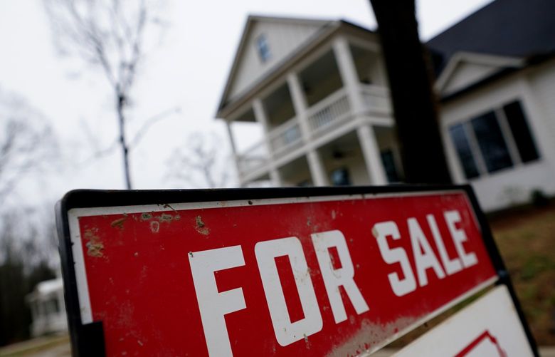 FILE – In this Thursday, Feb. 18, 2021 file photo, a new home is for sale in Madison, Ga. (AP Photo/John Bazemore, File) 