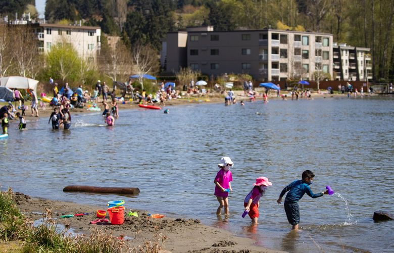 People enjoy the unseasonably warm weather at Juanita Beach Park in Kirkland Sunday April 18, 2021. 216931