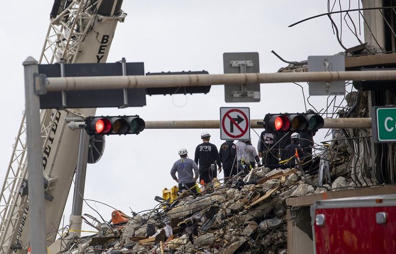 Search and rescue teams look for possible survivors and to recover remains on Wednesday, June 30, 2021 at the site of the 12-story oceanfront Champlain Towers South Condo, at 8777 Collins Ave., that partially collapsed around 2 a.m. on Thursday, June 24, 2021 in Surfside, Fl. (Chris Day/Sun Sentinel/TNS) 20401642W 20401642W