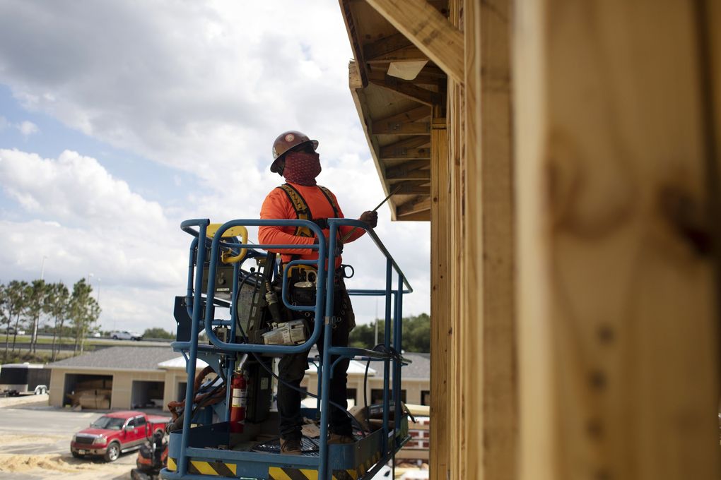 An apartment complex under construction in Orlando, Fla., on April 26, 2021. The pandemic has slowed sawmill operations, causing a shortage of lumber that has hampered home building in the United States. (Octavio Jones / The New York Times)