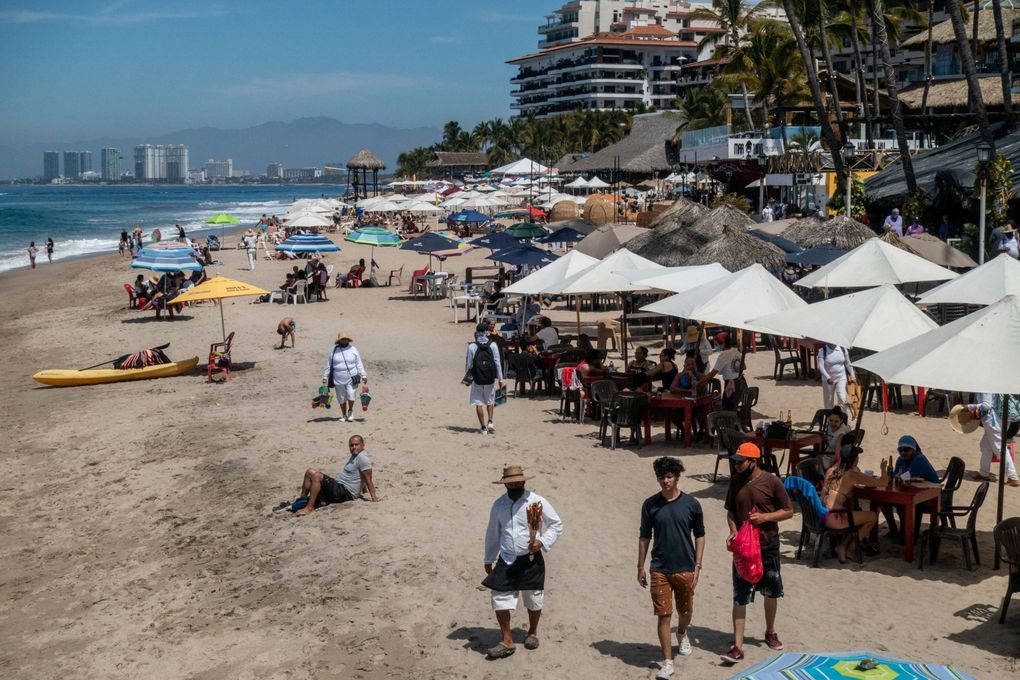 A busy beach in Puerto Vallarta, Jalisco state, Mexico, on March 6, 2021. (Cesar Rodriguez / Bloomberg)