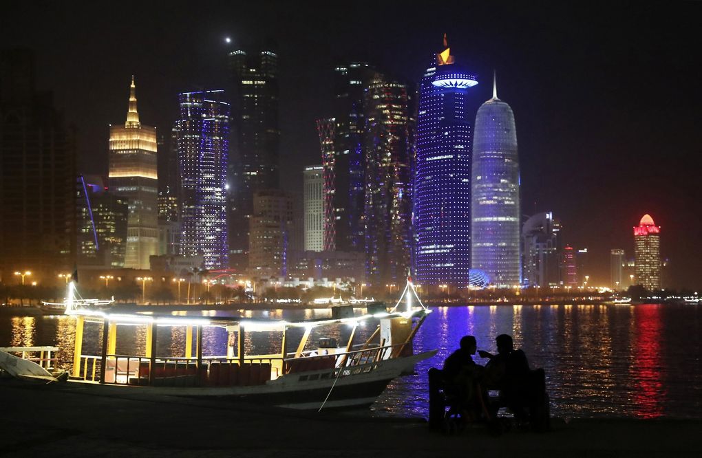 In this May 14, 2019, file photo, two people talk at the Corniche waterfront promenade in Doha, Qatar. (Kamran Jebreili / The Associated Press)