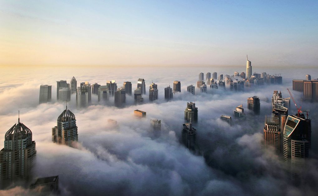 In this Monday, Oct. 5, 2015 photo, a thick blanket of early morning fog partially shrouds the skyscrapers of the Marina and Jumeirah Lake Towers districts of Dubai, United Arab Emirates. Dubai’s rapid transformation from a desert outpost into one of the world’s most architecturally stunning cities is mapped out in the Marina. Where just 15 years ago there was empty, flat land, today a bustling neighborhood thrives centered around a canal and an impressive skyline that pierces through the clouds. (Kamran Jebreili / The Associated Press)