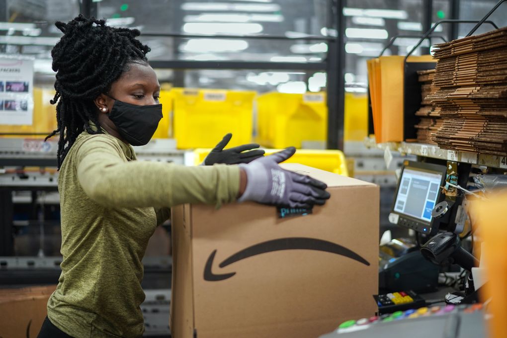 A worker in the packing area at Amazon’s warehouse on Staten Island, called JFK8, in March. (Chang W. Lee / The New York Times)