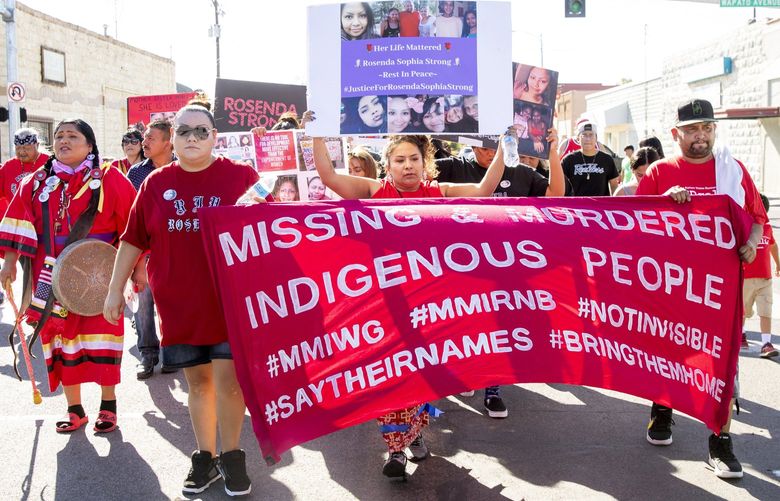 Cissy Strong Reyes, center, front, leads a march to honor her slain sister, Rosenda Strong, through the streets of Wapato, Yakima County August 31, 2019. Rosenda Strong was last seen a year ago, in October of 2018. Authorities and family searched for her until her remains were found on July 4, 2019, in an unplugged freezer in Wapato. No suspects have been named or charged with her death, and her family has yet to be able to hold a proper burial, as the investigation is ongoing.  211669