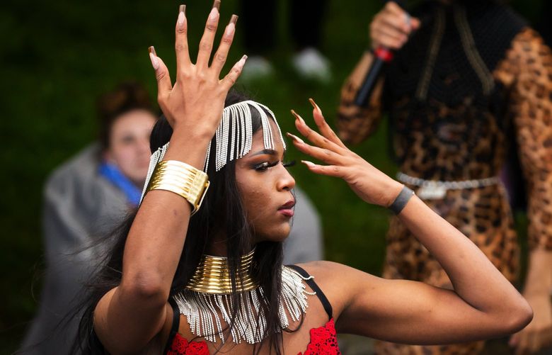 Trayon Michael, a member of the Royal House of Noir, competes in face during the Royal Youth Kiki Ball outside the Langston Hughes Performing Arts Center in Seattle Saturday, June 5, 2021.