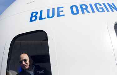 FILE — Jeff Bezos in a mockup of the crew capsule of his space company, Blue Origin, during the 33rd Space Symposium in Colorado Springs, Colo., April 5, 2017. Bezos said on Monday, June 7, 2021, that he would be on board when his rocket company, Blue Origin, conducts its first human spaceflight next month, shortly after he steps down as chief executive of Amazon. (Nick Cote/The New York Times)
