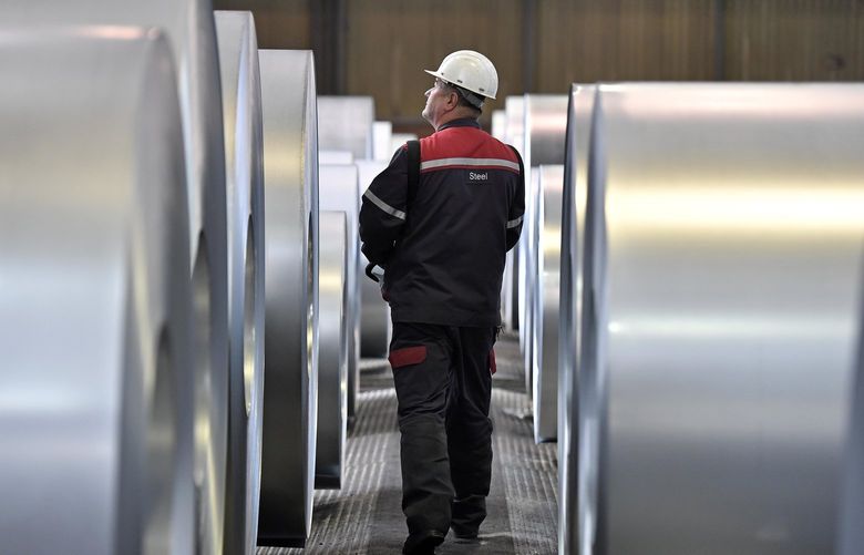 FILE – In this April 27, 2018 file photo, a worker controls steel coils at the thyssenkrupp steel factory in Duisburg, Germany. The European Union and the United States have decided to temporarily suspend measures at the heart of a steel tariff dispute that is seen as one of the major trade issues dividing the two sides. The issue goes back to the 2018 tariffs that then-President Donald Trump slapped on EU steel and aluminum, which enraged Europeans and other allies by calling their metals a threat to U.S. national security. (AP Photo/Martin Meissner, File)