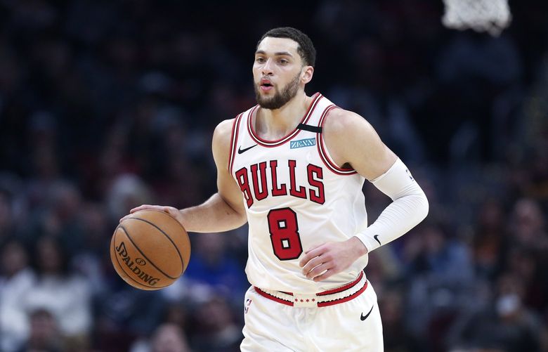 Chicago Bulls’ Zach LaVine (8) brings the ball up the floor against the Cleveland Cavaliers in the second half of an NBA basketball game, Saturday, Jan. 25, 2020, in Cleveland. The Bulls defeated the Cavaliers 118-106. (AP Photo/Ron Schwane)