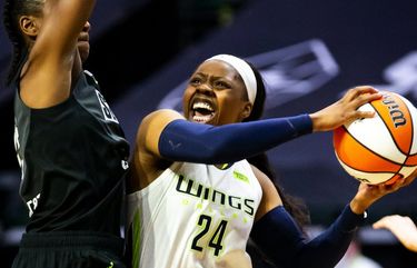 Seattle guard Jewell Loyd fouls Dallas guard Arike Ogunbowale in the fourth quarter as the Seattle Storm take on the Dallas Wings at the Angel of the Winds Arena in Everett Sunday June 6, 2021. 217312