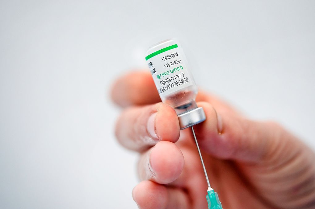 FILE – In this Friday, May 28, 2021 file photo, a healthcare worker prepares a dose of the Sinovac COVID-19 vaccine during a vaccination session for medical staff who work at private clinics in Caracas, Venezuela. The World Health Organization has issued an emergence use listing for the COVID-19 vaccine made by Sinovac in adults aged 18 and over, the second such authorization it has granted to a Chinese company. In a statement on Tuesday, June 1 the U.N. health agency said data submitted to its experts showed that two doses of the vaccine prevented people from getting symptoms of COVID-19 in about half of those who got the vaccine.(AP Photo/Matias Delacroix, file)