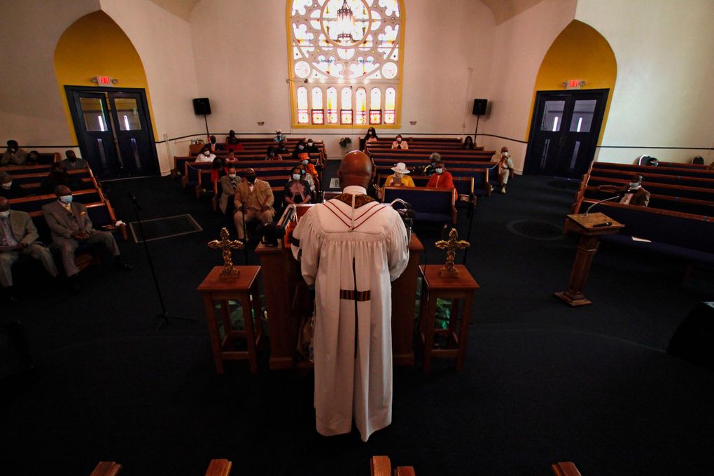 In this May 9, 2021, photo, Rev. Joseph Jackson Jr. talks to his congregation at Friendship Missionary Baptist Church in Milwaukee during a service. He is president of the board of directors for Milwaukee Inner City Congregations Allied for Hope, which along with Pastors United, Souls to the Polls and the local health clinic Health Connections, is working to get vaccination clinics into churches to help vaccinate the Black community. He’s also been urging his congregation during Sunday services to get vaccinated. (AP Photo/Carrie Antlfinger)
