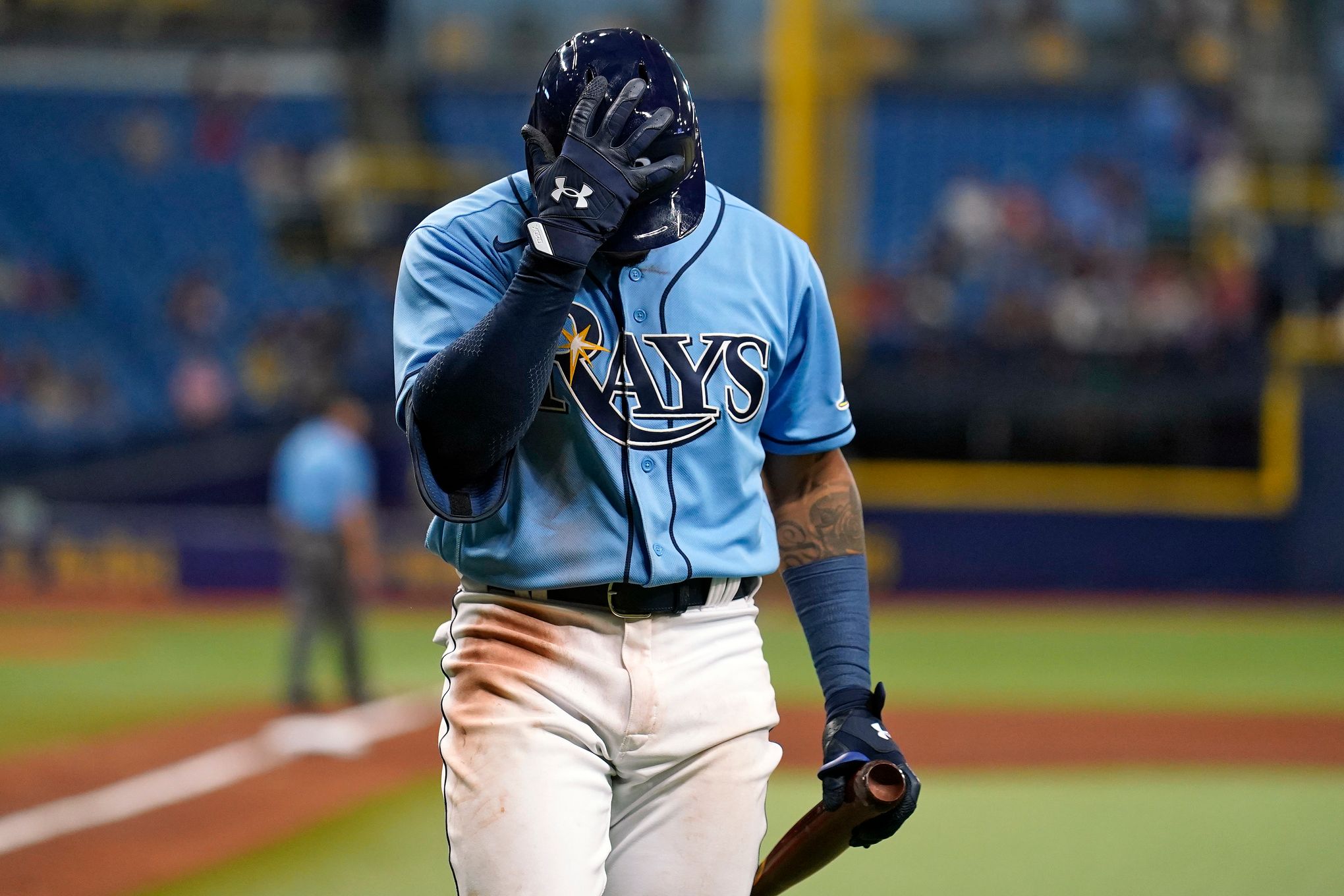 Tampa Bay Rays' Brandon Lowe throws his helmet after striking out