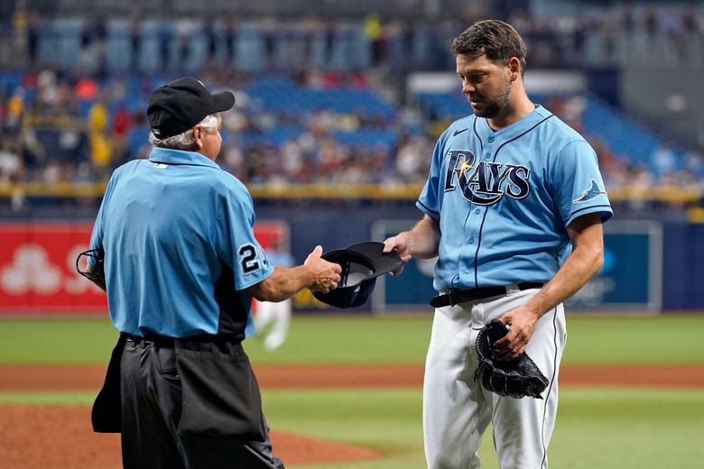 Tampa Bay Rays' Brandon Lowe throws his helmet after striking out