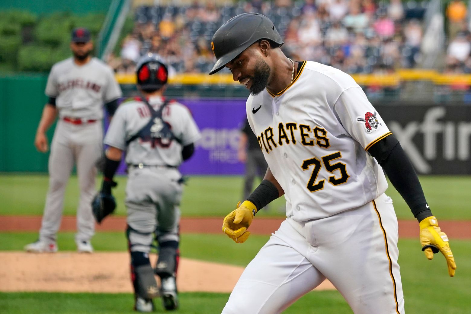 Pittsburgh Pirates' Adam Frazier, right, stands on third base next