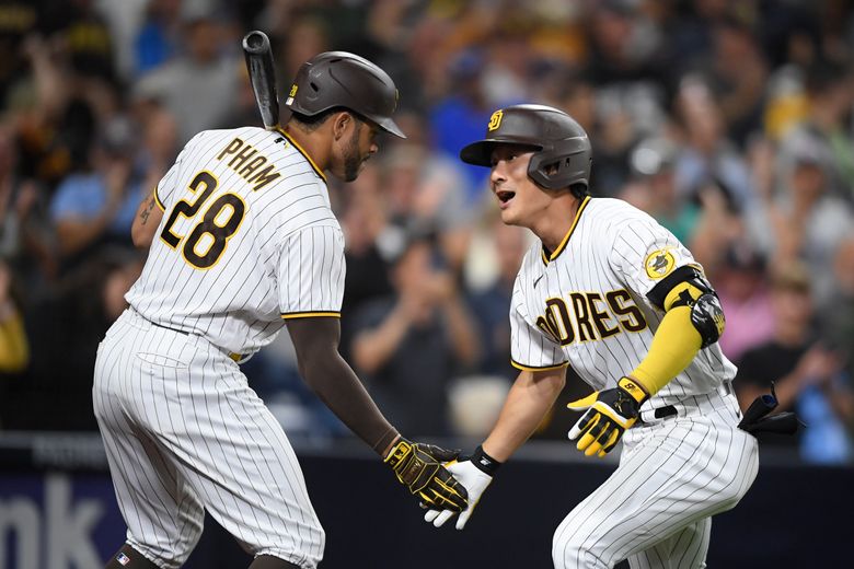 Ha-Seong Kim of the San Diego Padres is congratulated by Fernando