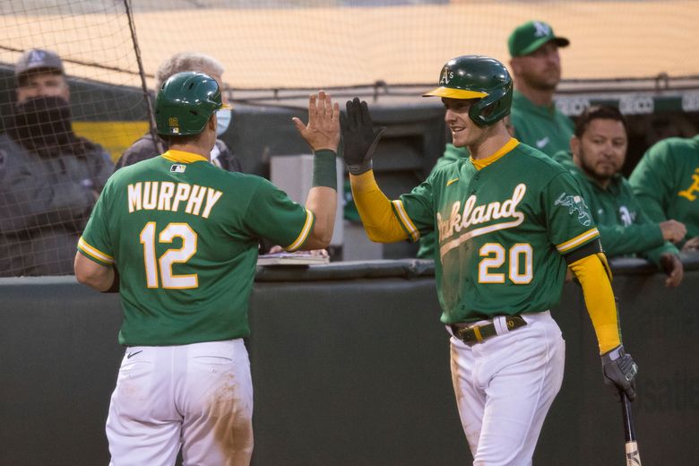 Sean Murphy of the Oakland Athletics chases after a pitch in the