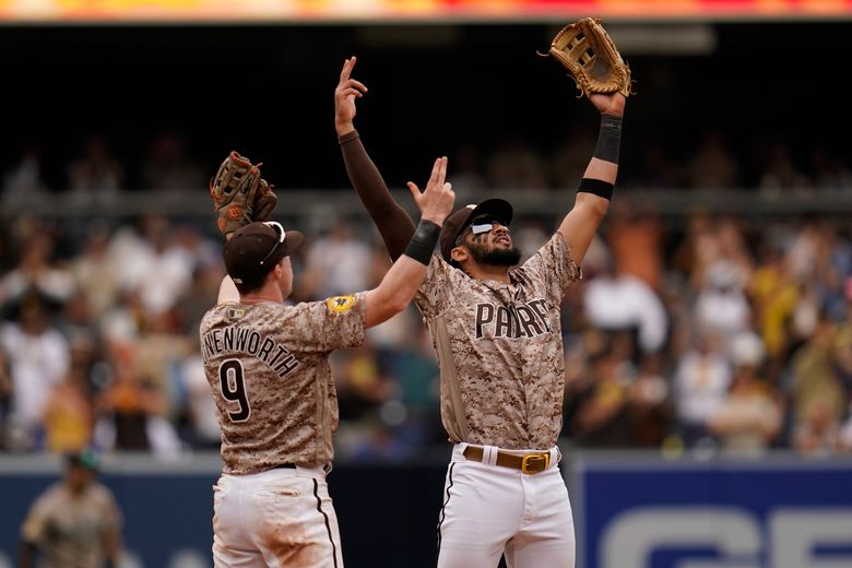 San Diego Padres' Jake Cronenworth, right, celebrates with