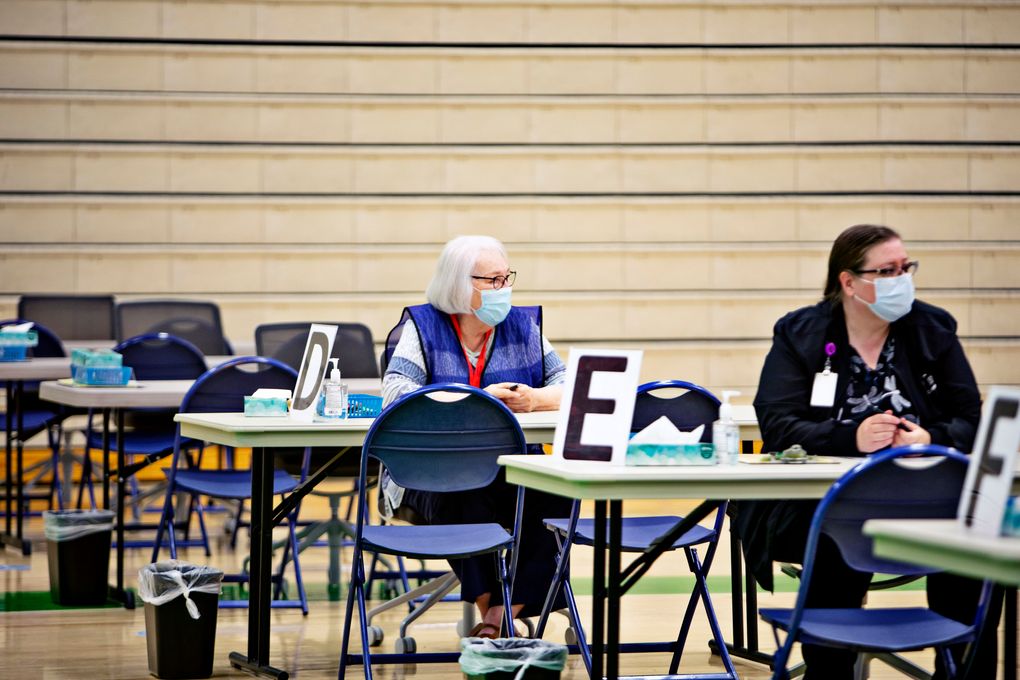 Health workers wait for people seeking shots at a vaccination clinic in Provo, Utah, on June 2. (Photo by Kim Raff for The Washington Post).