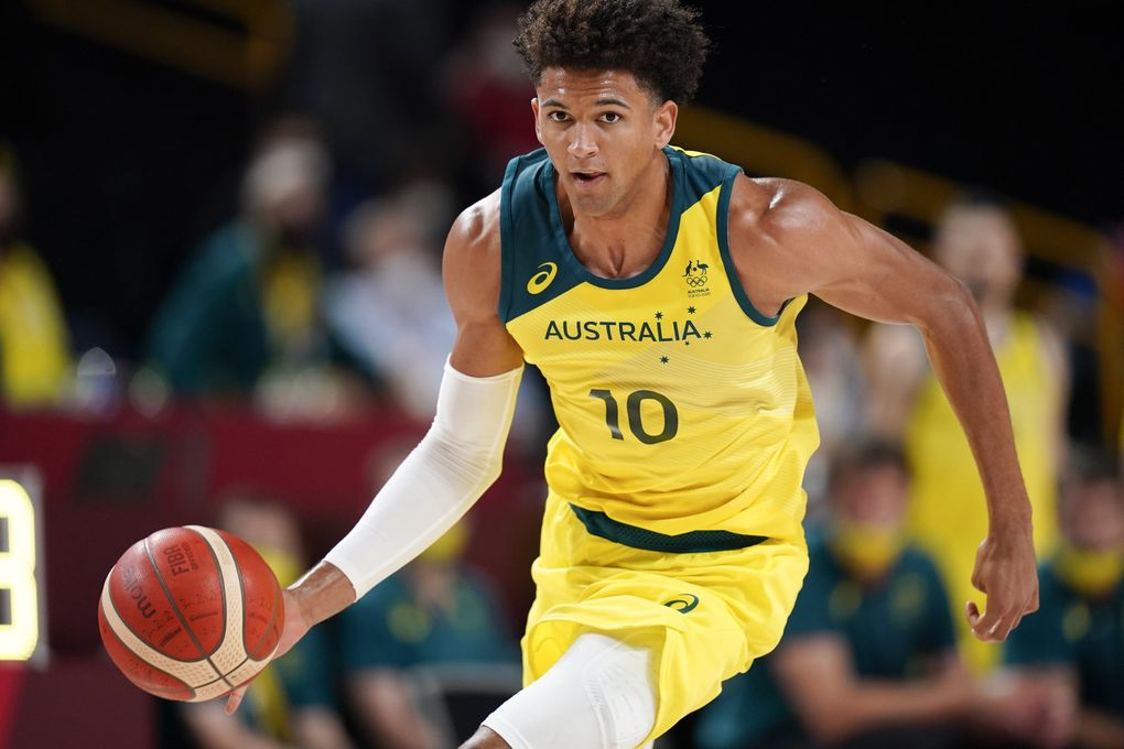 Australia’s Matisse Thybulle drives up court during a men’s basketball preliminary round game against Nigeria at the 2020 Summer Olympics, Sunday, July 25, 2021, in Saitama, Japan.(Charlie Neibergall / The Associated Press)