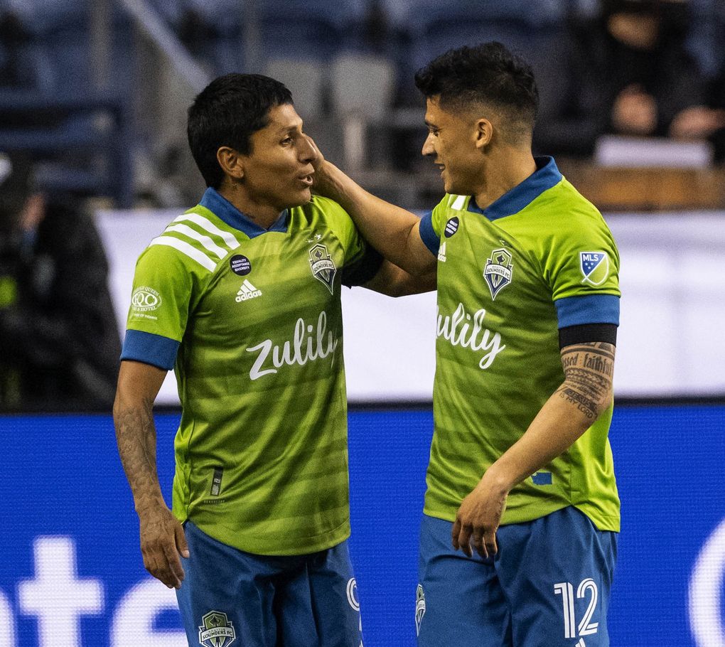 Raul Ruidiaz, left, and Fredy Montero accounted for 3 of Seattle’s 4 goals scored Friday against Minnesota. Minnesota United FC played the Seattle Sounders FC in the Major League Season opener Friday, April 16, 2021 at Lumen Field in Seattle, WA. (Dean Rutz / The Seattle Times)