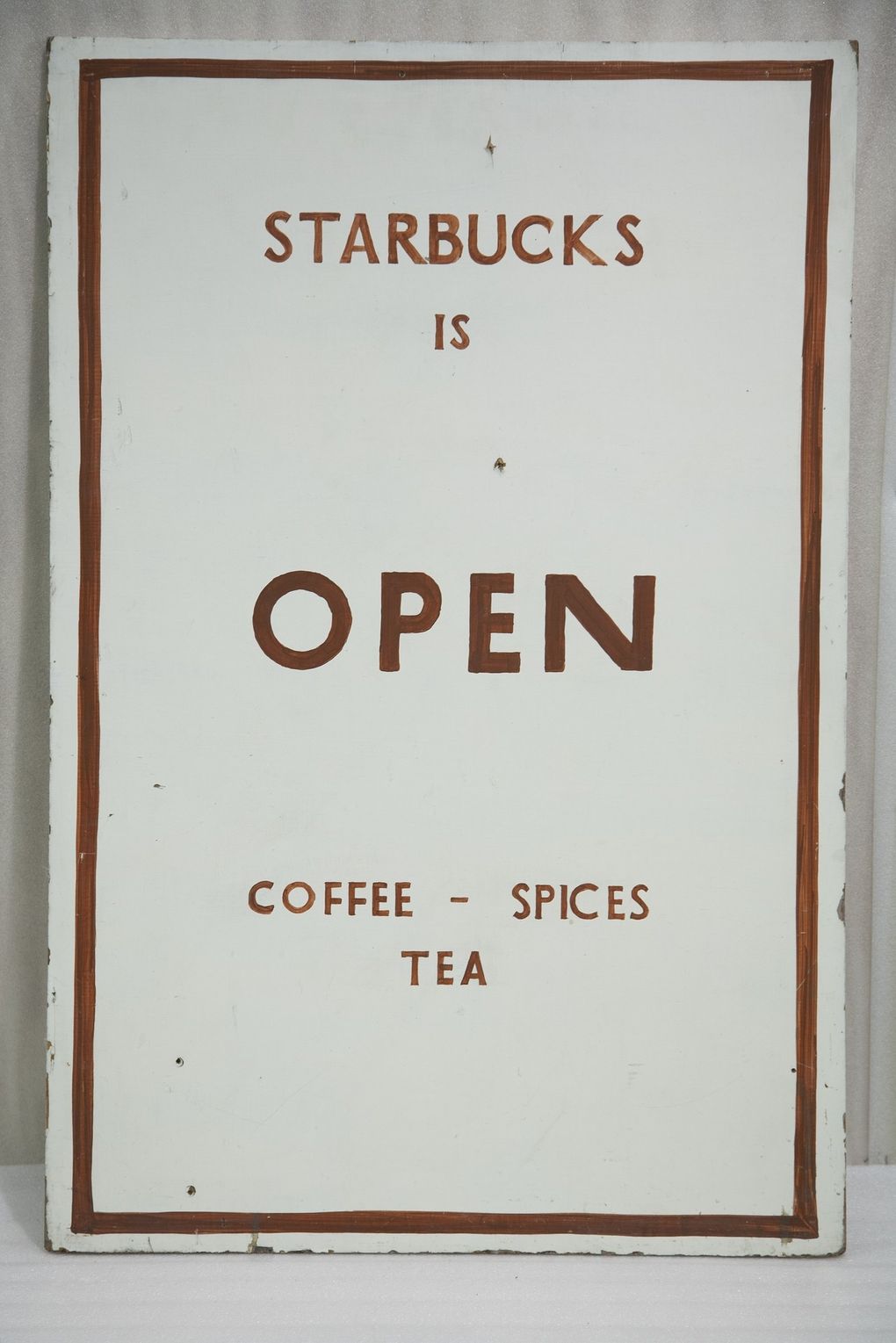 A hand-painted original sidewalk sign from the first Starbucks store in 1971 lives on at MOHAI. (Courtesy of MOHAI)