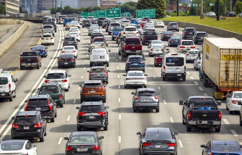 FILE — Evening rush hour traffic in downtown Atlanta, June 8, 2021. The rapid run-up in gas prices comes at a delicate moment for the U.S. economy, which was already experiencing the fastest inflation in years. (Audra Melton/The New York Times) XNYT111