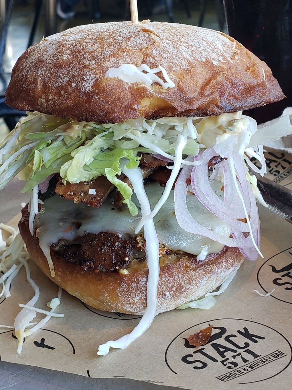 Bethany’s burger at the new Totem Lake Stack 571 Burger & Whiskey Bar gave an admirable all-American performance, made with all-natural, humanely raised beef from Eastern Washington. (Courtesy of Stack 571 Burger & Whiskey Bar)