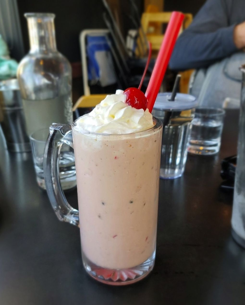 The adult milkshakes get shots of booze, fluffy hats of aerosol whipped cream and large-gauge straws to accelerate them into their adult at Stack 571. (Courtesy of Stack 571 Burger & Whiskey Bar)