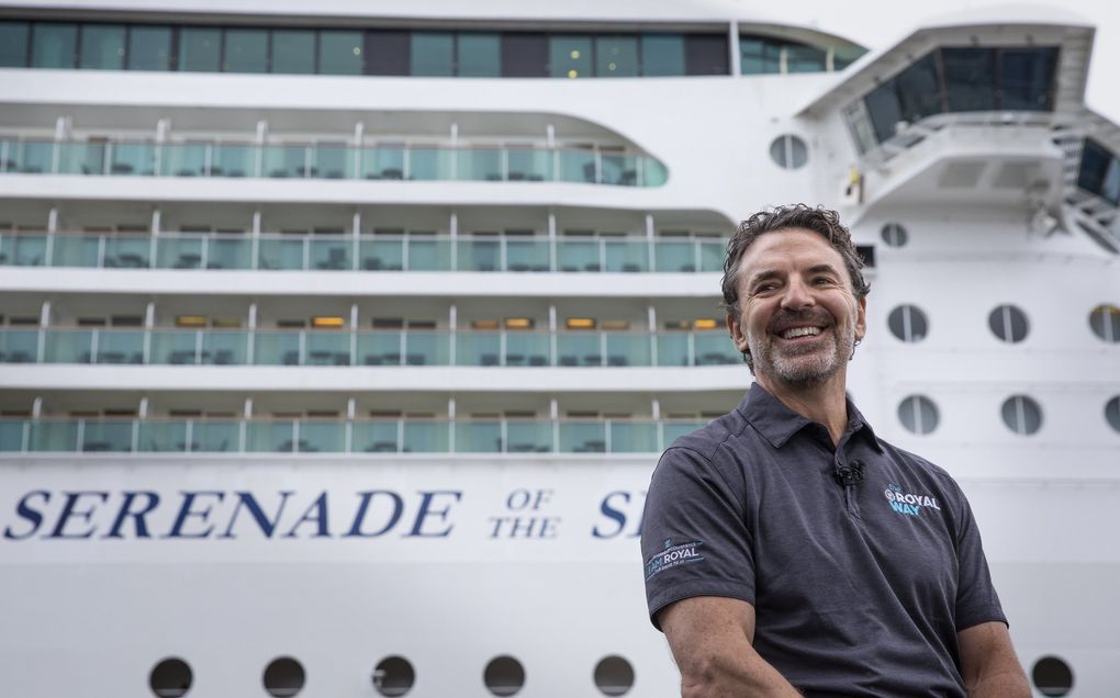 Mark Tamis, senior vice president with Royal Caribbean International, is all smiles July 7, 2021, as he talks about the cruising season reopening with the Serenade of the Seas tied up behind him at Pier 91 in Seattle. Later that Wednesday, the ship departed for Ketchikan, Alaska, toting about 300 passengers, all Royal Caribbean employees, for a four-day simulation voyage. (Ellen M. Banner / The Seattle Times)