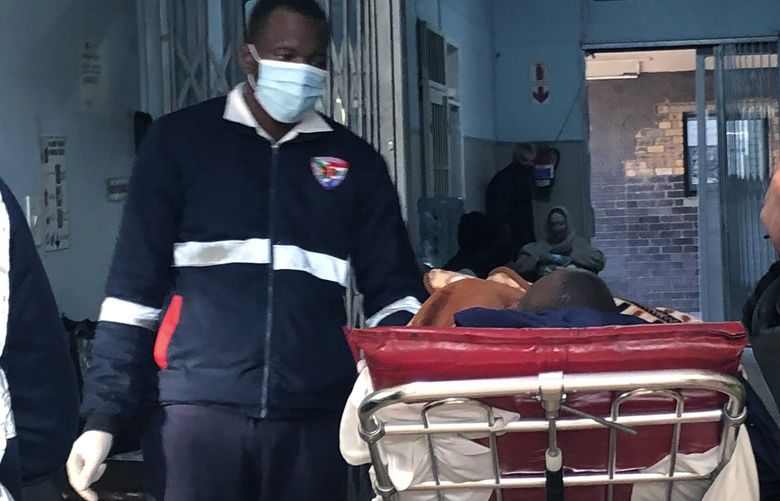 A COVID-19 patient is admitted to a hospital in Johannesburg, Wednesday, June 23, 2021. South Africa’s third wave of COVID-19 infections is overwhelming the health system in Gauteng, the country’s most populous province that is now running out of beds to treat patients. (AP Photo)