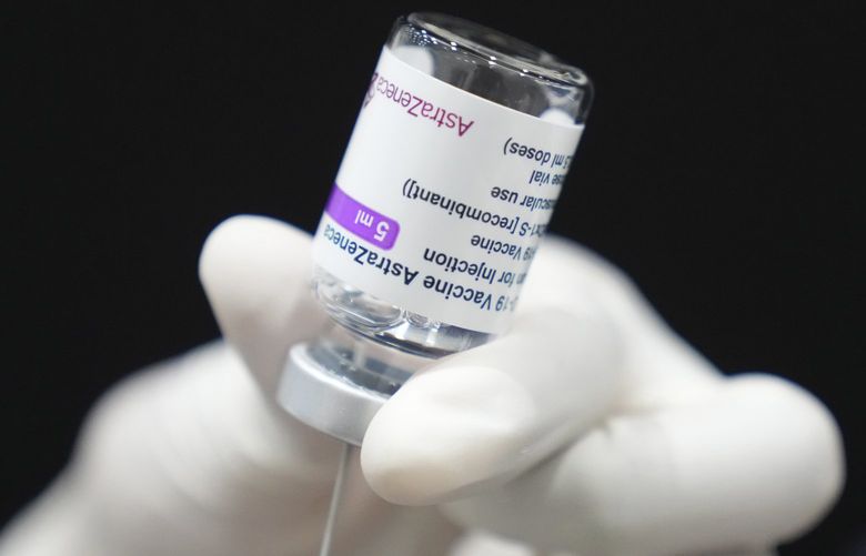 In this June 7, 2021, file photo, a health worker prepares a dose of a COVID-19 vaccine at the shopping mall in Bangkok, Thailand. As Thailandâ€™s capital city Bangkok and several other provinces on Monday, July 12, 2021, marked the first day of a nighttime curfew and other heightened restrictions against the spread of the coronavirus, health officials announced that medical workers will get booster shots against COVID-19 even after already receiving two jabs. (AP Photo/Sakchai Lalit, File) BKWS303 BKWS303