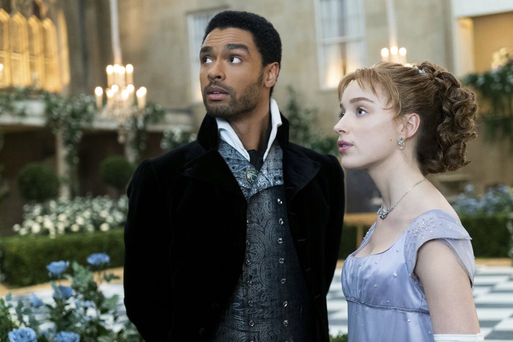 Rege-Jean Page and Phoebe Dynevor in “Bridgerton.” The TV series, based on the novels by Seattle author Julia Quinn, earned 12 Emmy Award nominations Tuesday, including for outstanding drama series. (Liam Daniel / Netflix)