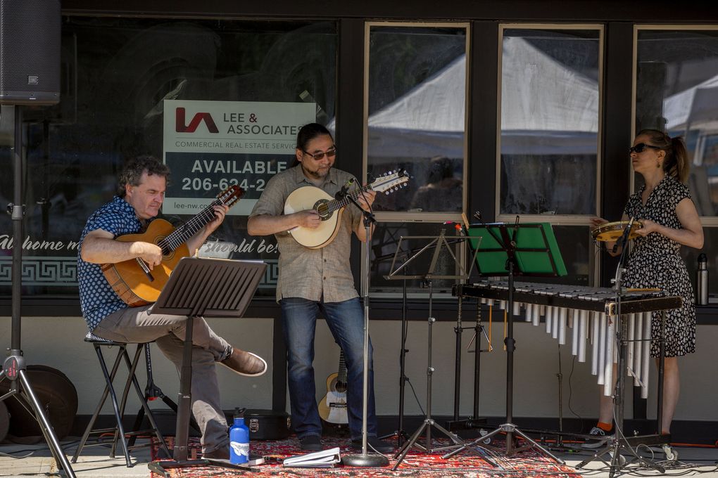 Members of the Choroloco Brazilian Jazz band play during Inside OUT in Kent. (Sylvia Jarrus / The Seattle Times)