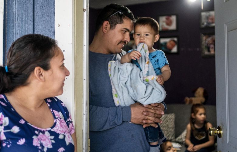 Jose Espinoza, a farmworker in Porterville, Calif., and his wife Elizabeth Elias, pictured here with their four children, are expected to be among the beneficiaries of the expanded child tax credit included in the $1.9 trillion coronavirus aid package. MUST CREDIT: Washington Post photo by Melina Mara.