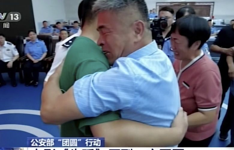 In this image taken from a video footage run by China’s CCTV via AP Video, Guo Gangtang at right embraces his long lost son Guo Xinzhen during a reunion after 24 years in Liaocheng in Central China’s Shandong province on Sunday, July 11, 2021. Guo was abducted as a toddler outside their home. (CCTV via AP Video) XBEJ401 XBEJ401